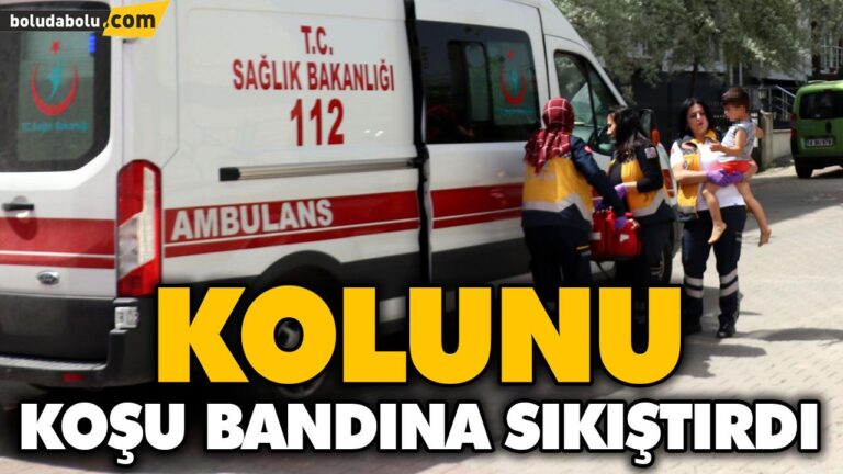 KOLUNU KOŞU BANDINA SIKIŞTIRDI