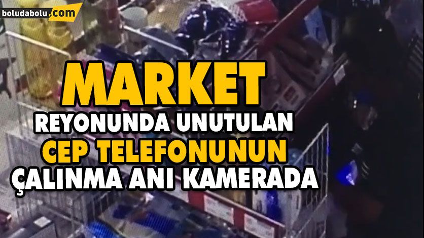 Market reyonunda unutulan cep telefonunun çalınma anı kamerada Market reyonunda unutulan cep telefonunun çalınma anı kamerada