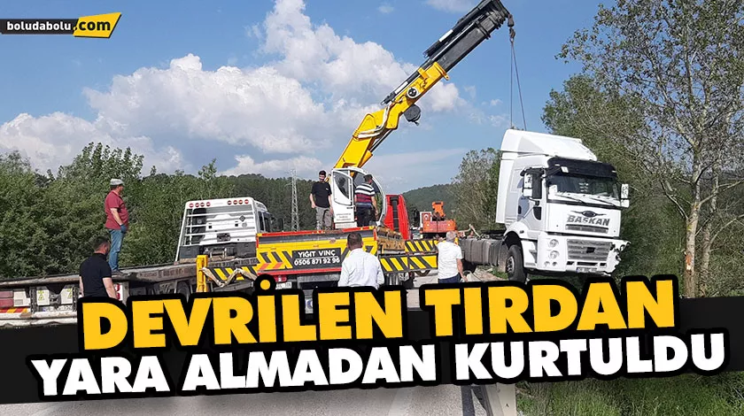 DEVRİLEN TIRDAN YARA ALMADAN KURTULDU DEVRİLEN TIRDAN YARA ALMADAN KURTULDU