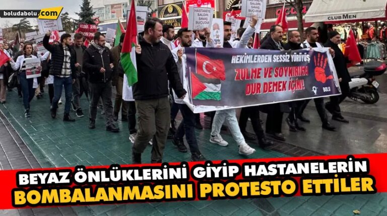 BEYAZ ÖNLÜKLERİNİ GİYİP HASTANELERİN BOMBALANMASINI PROTESTO ETTİLER