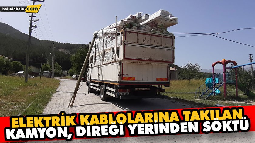 ELEKTRİK KABLOLARINA TAKILAN KAMYON, DİREĞİ YERİNDEN SÖKTÜ